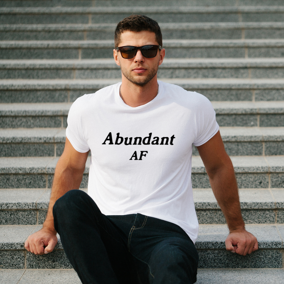 Model wearing a crew neck t-shirt with Abundant AF printed in block letters and centered on the chest.
Wear it, own it, live it.