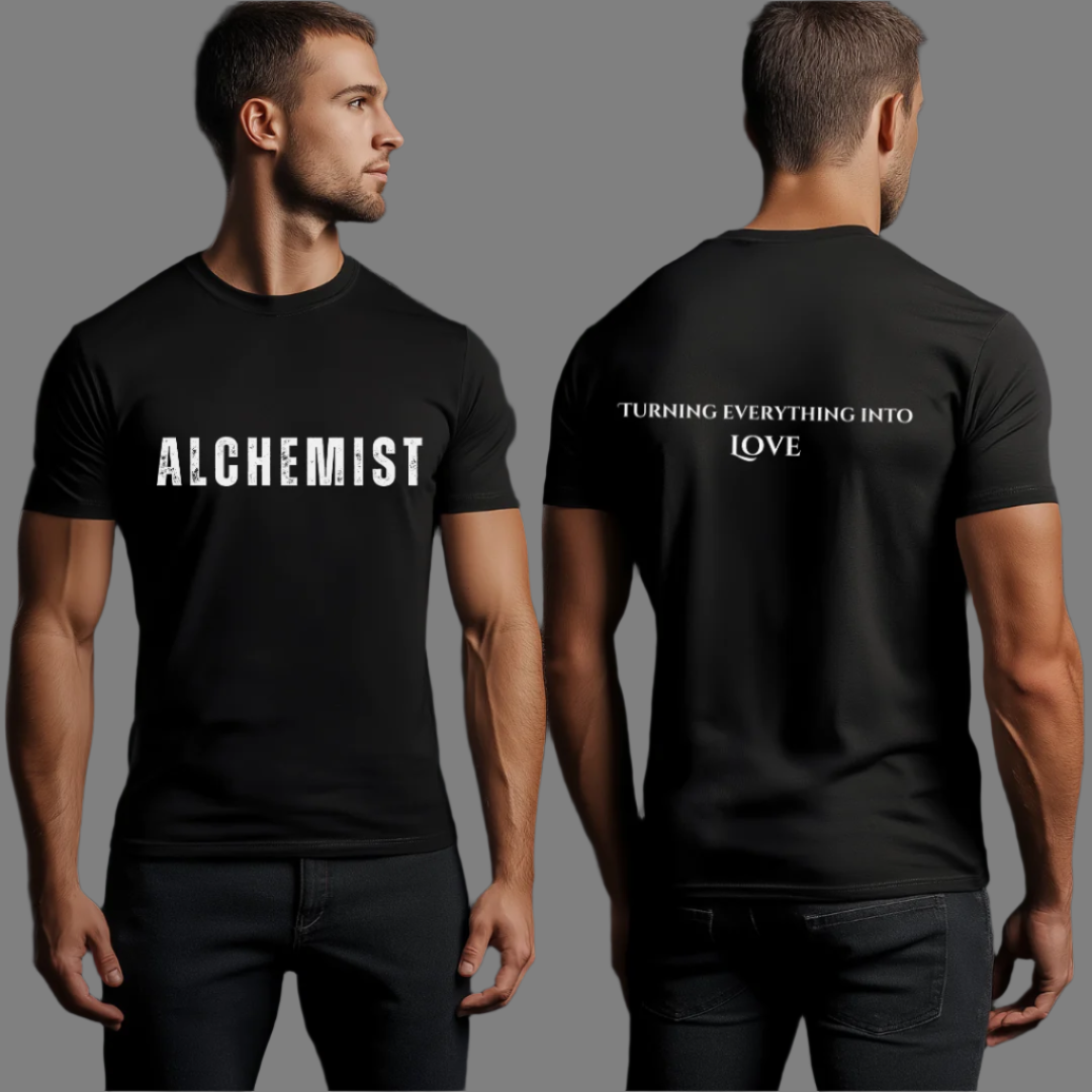 Model wearing crew neck, short sleeve T-shirt that reads 'ALCHEMIST' in distressed block letters across the chest. 'Turning Everything Into Love' in two lines of smaller block letters are written on the back. Embody love in all things.

