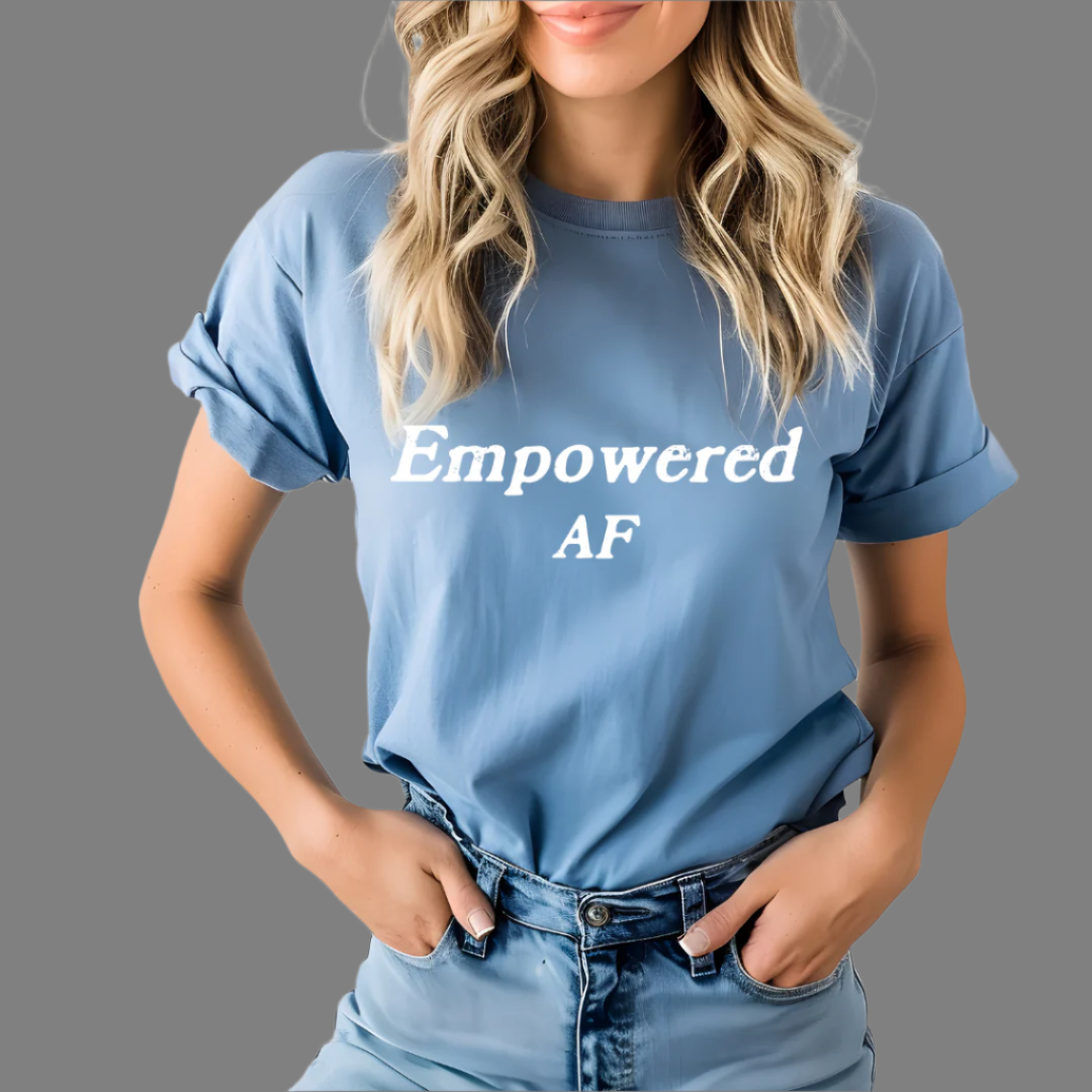 Model wearing a crew neck t-shirt with Empowered AF printed in block letters and centered on the chest.
Wear it, own it, live it.