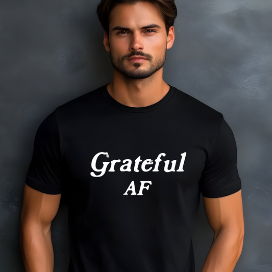 Model wearing a crew neck t-shirt with Grateful AF printed in block letters and centered on the chest.
Wear it, own it, live it.
