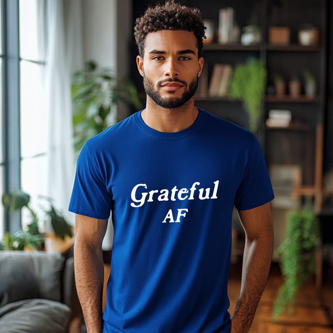 Model wearing a crew neck t-shirt with Grateful AF printed in block letters and centered on the chest.
Wear it, own it, live it.
