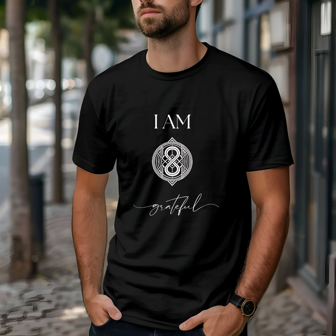 Model wearing a crew neck t-shirt,  with symbolic sigil centered on the chest, representing grateful.
The shirt reads 'I AM' in block font above the sigil and 'grateful' in script font below the sigil.
Declare to the world: I AM grateful.