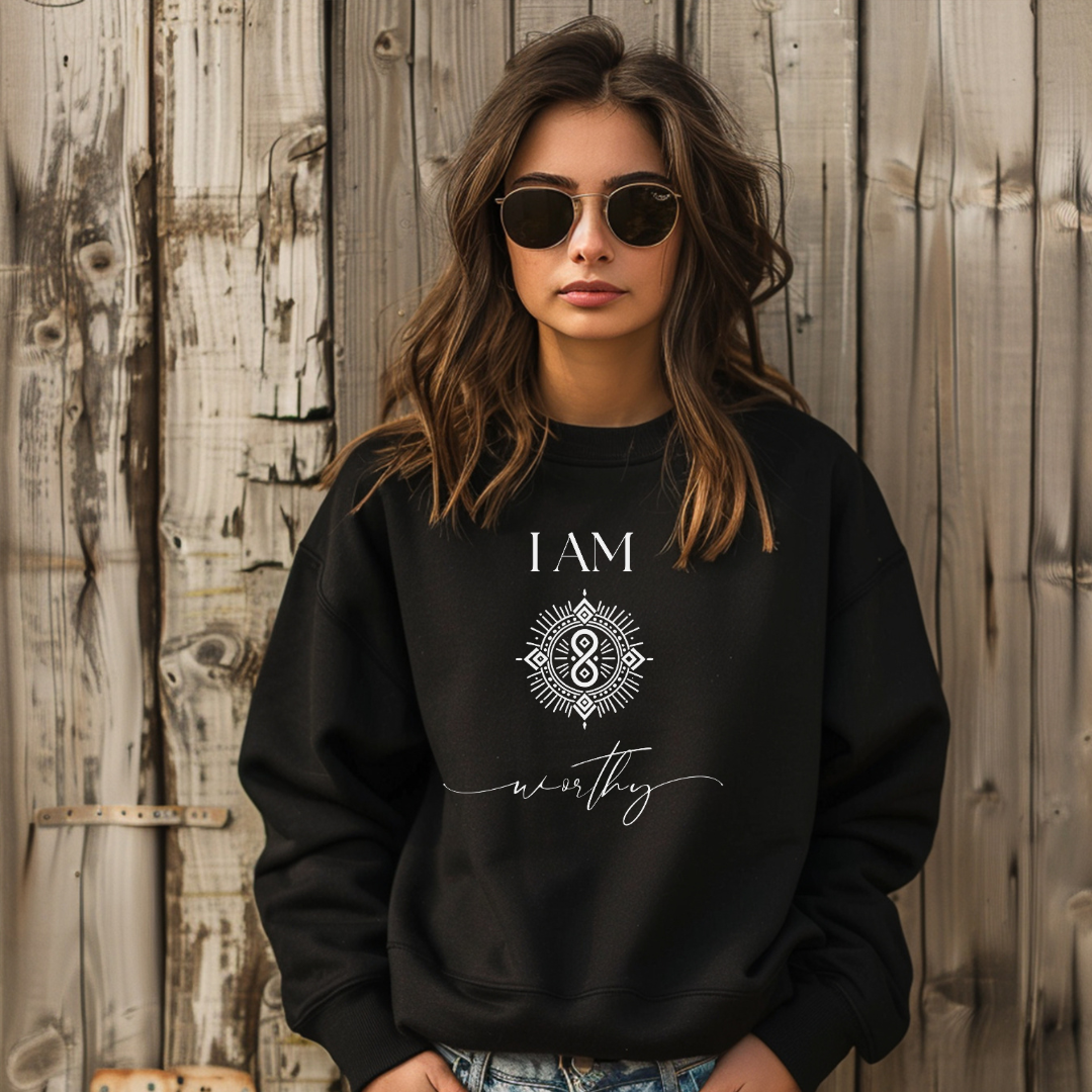 Model wearing a crew neck sweatshirt with symbolic sigil centered on the chest, representing worthy.
The shirt reads 'I AM' in block font above the sigil and 'worthy' in script font below the sigil.
Declare to the world: I AM worthy.
