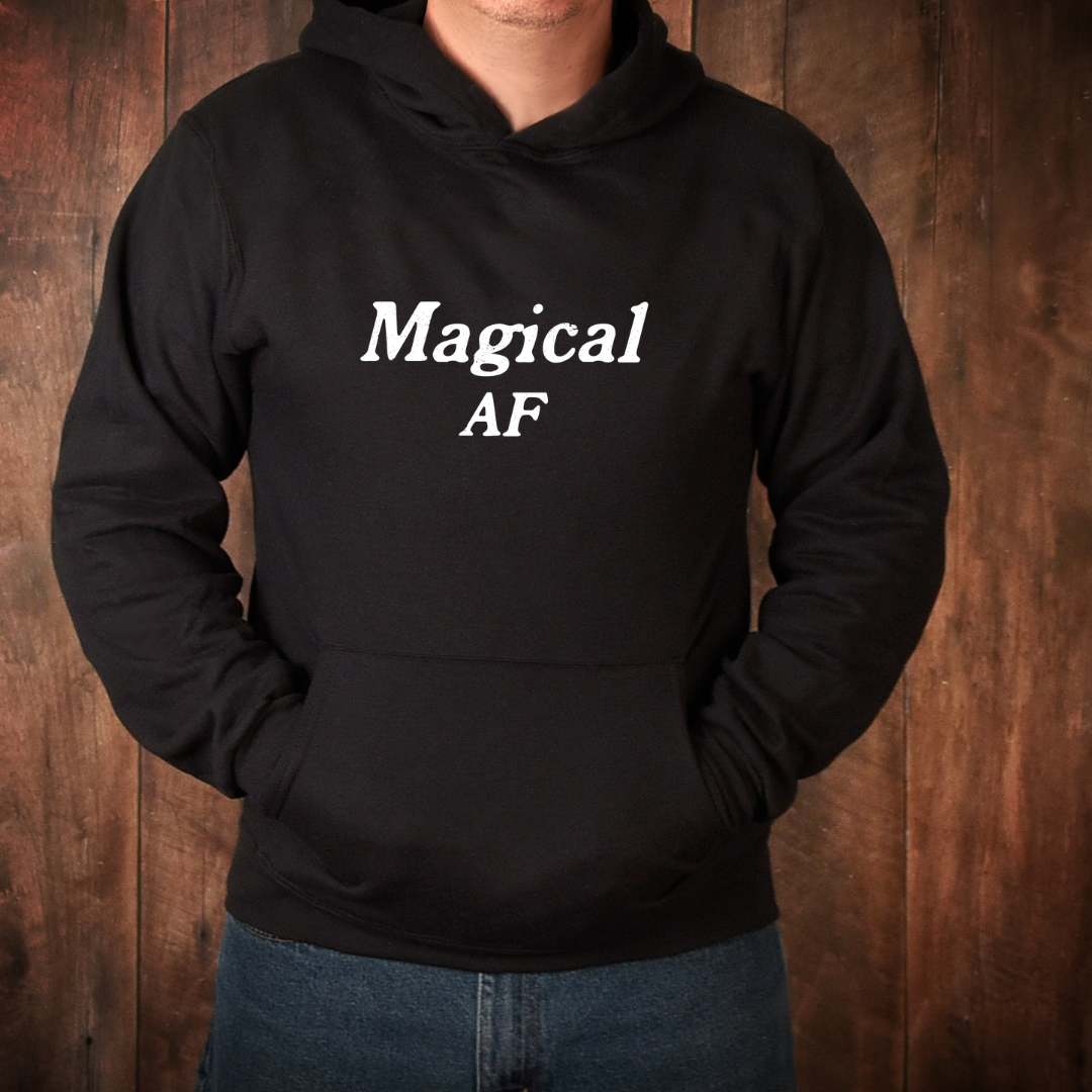 Model wearing a crew neck hoodie with Magical AF printed in block letters and centered on the chest.
Wear it, own it, live it.