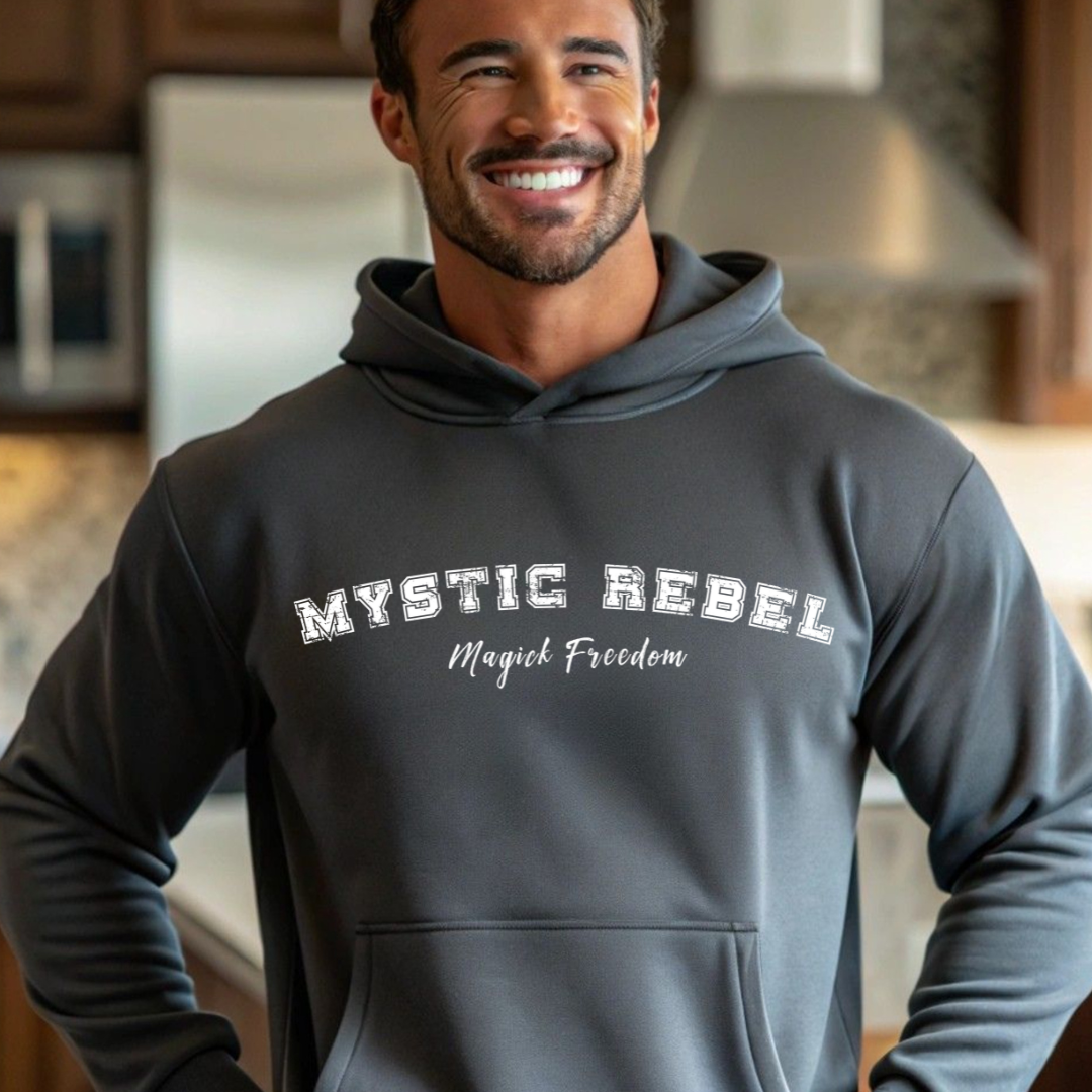 Model wearing a hoodie that reads Mystic Rebel in university font, arched across the chest with Magick Freedom in scripted font below.
Unleash your wild, untamed spirit!
