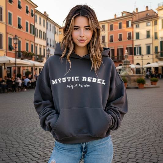 Model wearing a hoodie that reads Mystic Rebel in university font, arched across the chest with Magick Freedom in scripted font below.
Unleash your wild, untamed spirit!
