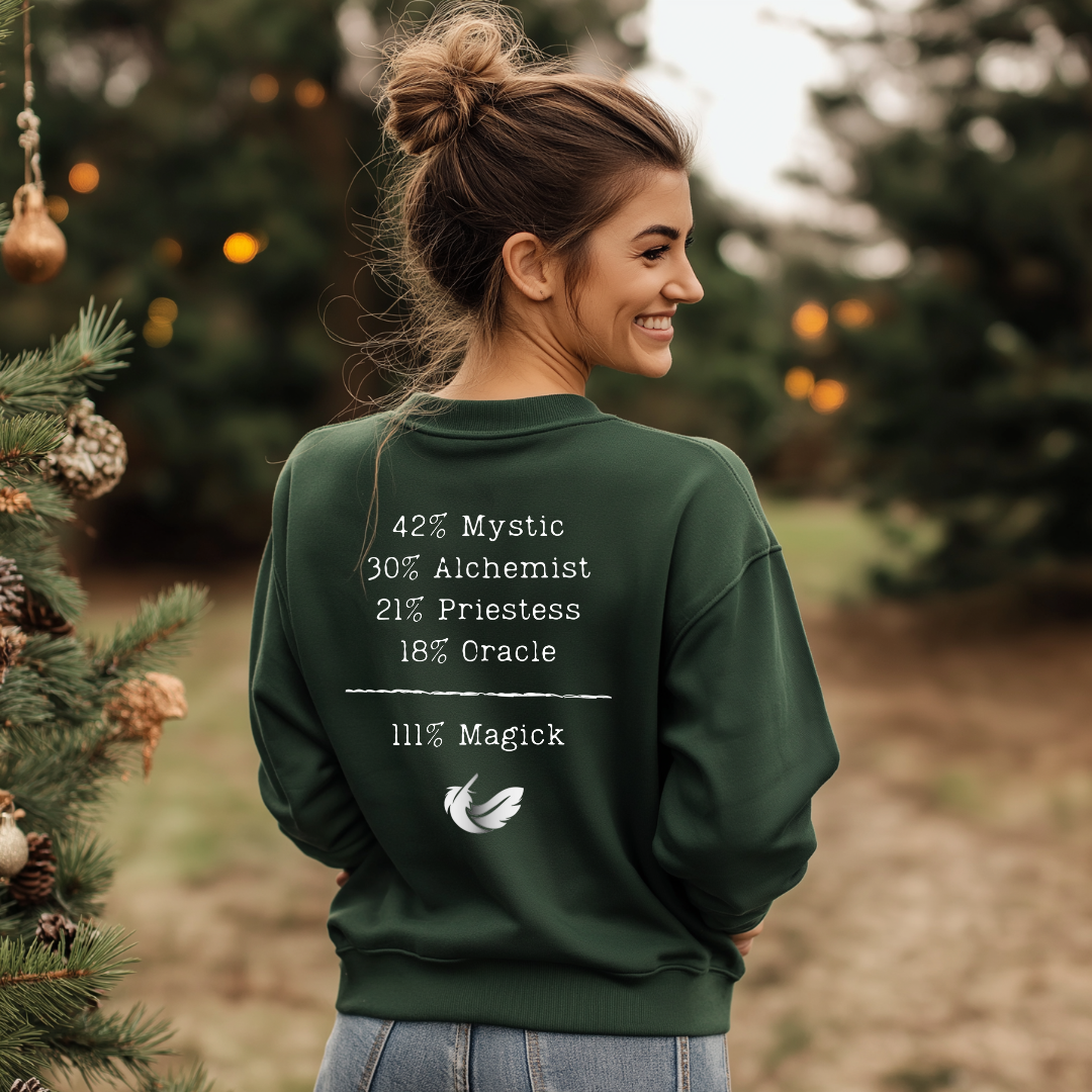 Model wearing a crew neck, 111% Magick sweatshirt. 
On the front left chest area is the Magick Freedom feather logo. 
The back of the shirt displays a breakdown of mystical archetypes, listing "42% Mystic, 30% Alchemist, 21% Priestess, 18% Oracle," followed by a line and the phrase "111% Magick".