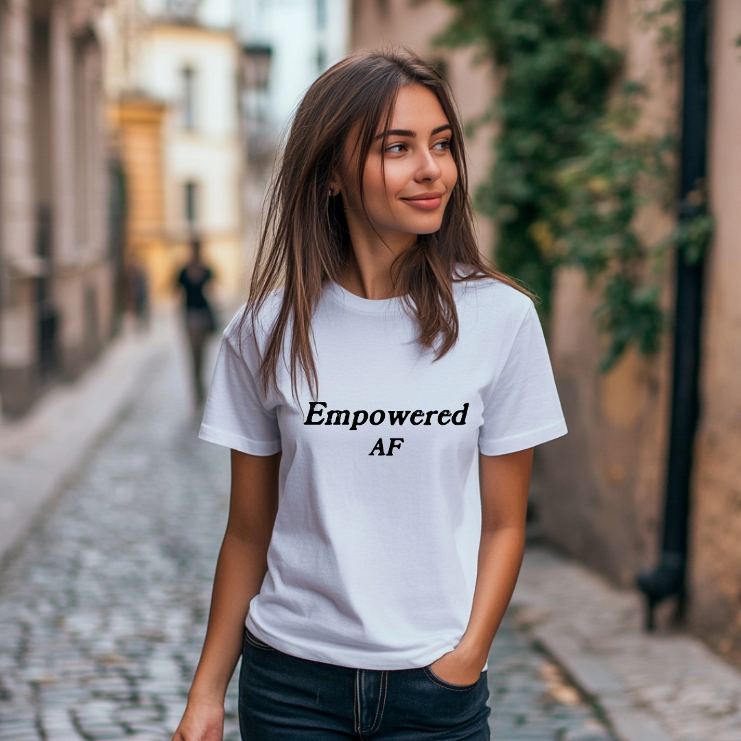 Model wearing a crew neck t-shirt with Empowered AF printed in block letters and centered on the chest.
Wear it, own it, live it.
