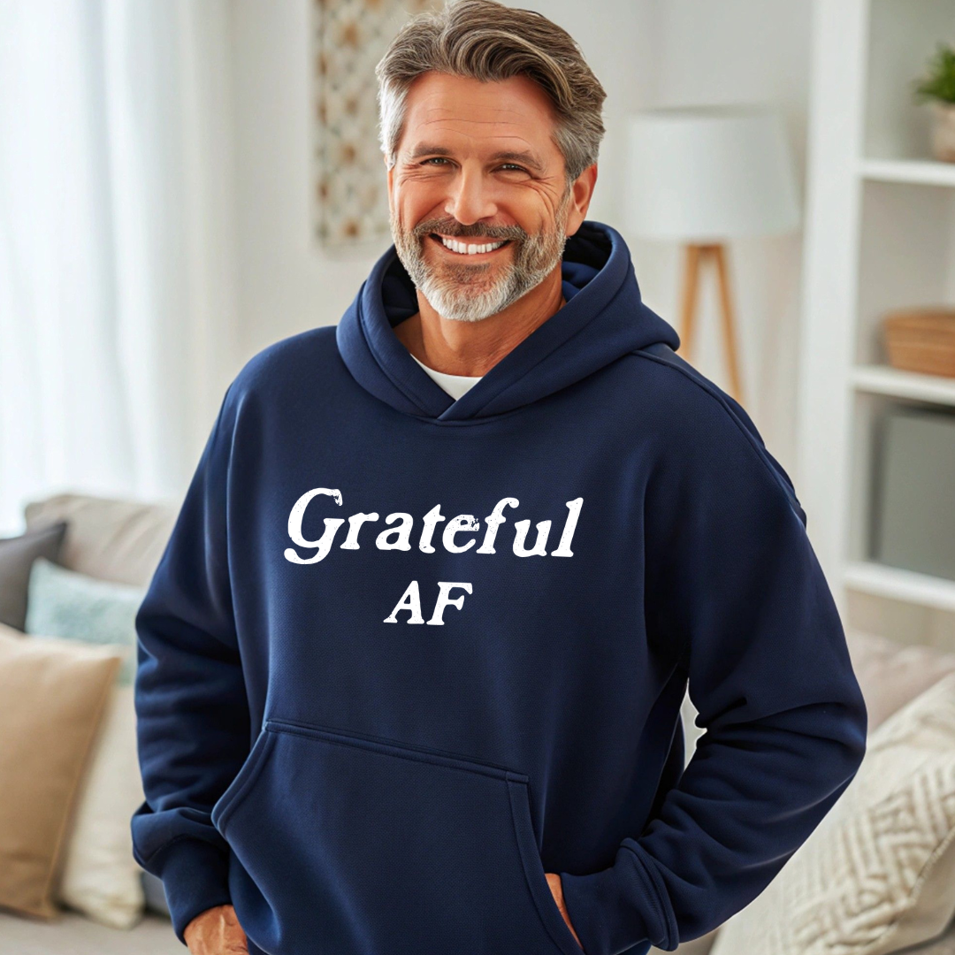 Model wearing a hoodie with Grateful AF printed in block letters and centered on the chest.
Wear it, own it, live it.