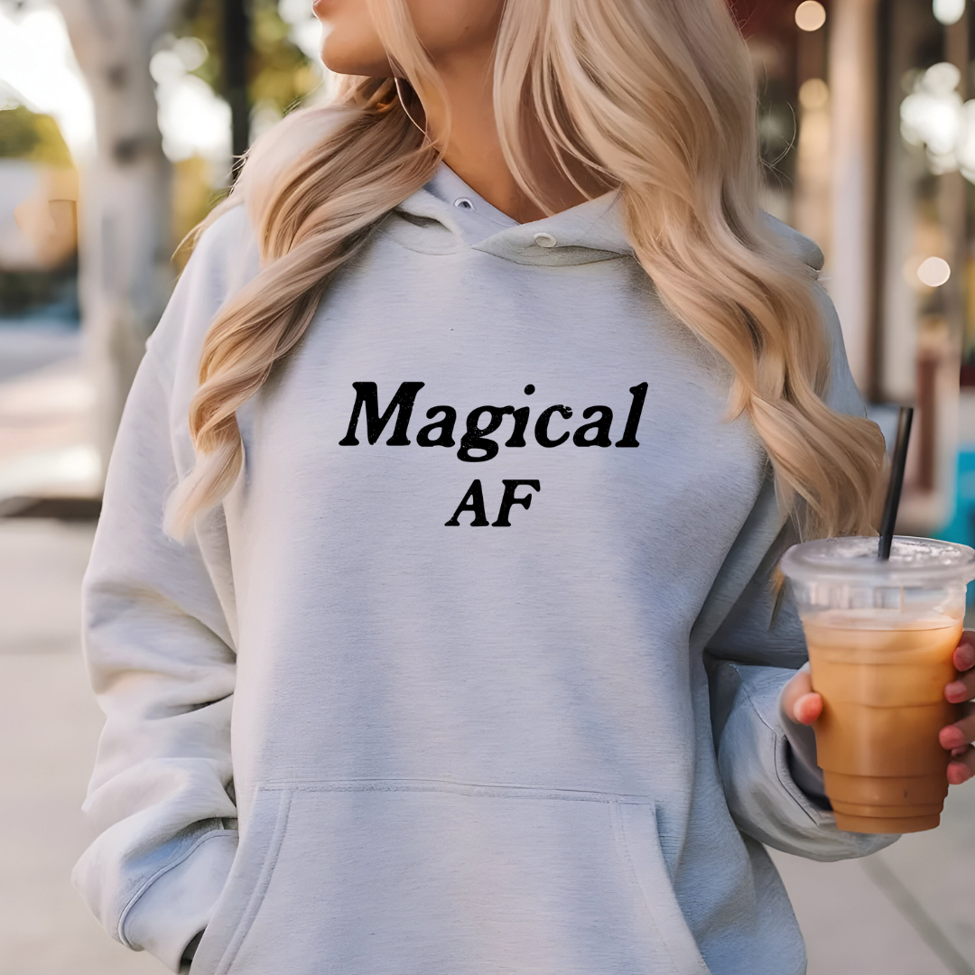 Model wearing a crew neck hoodie with Magical AF printed in block letters and centered on the chest.
Wear it, own it, live it.
