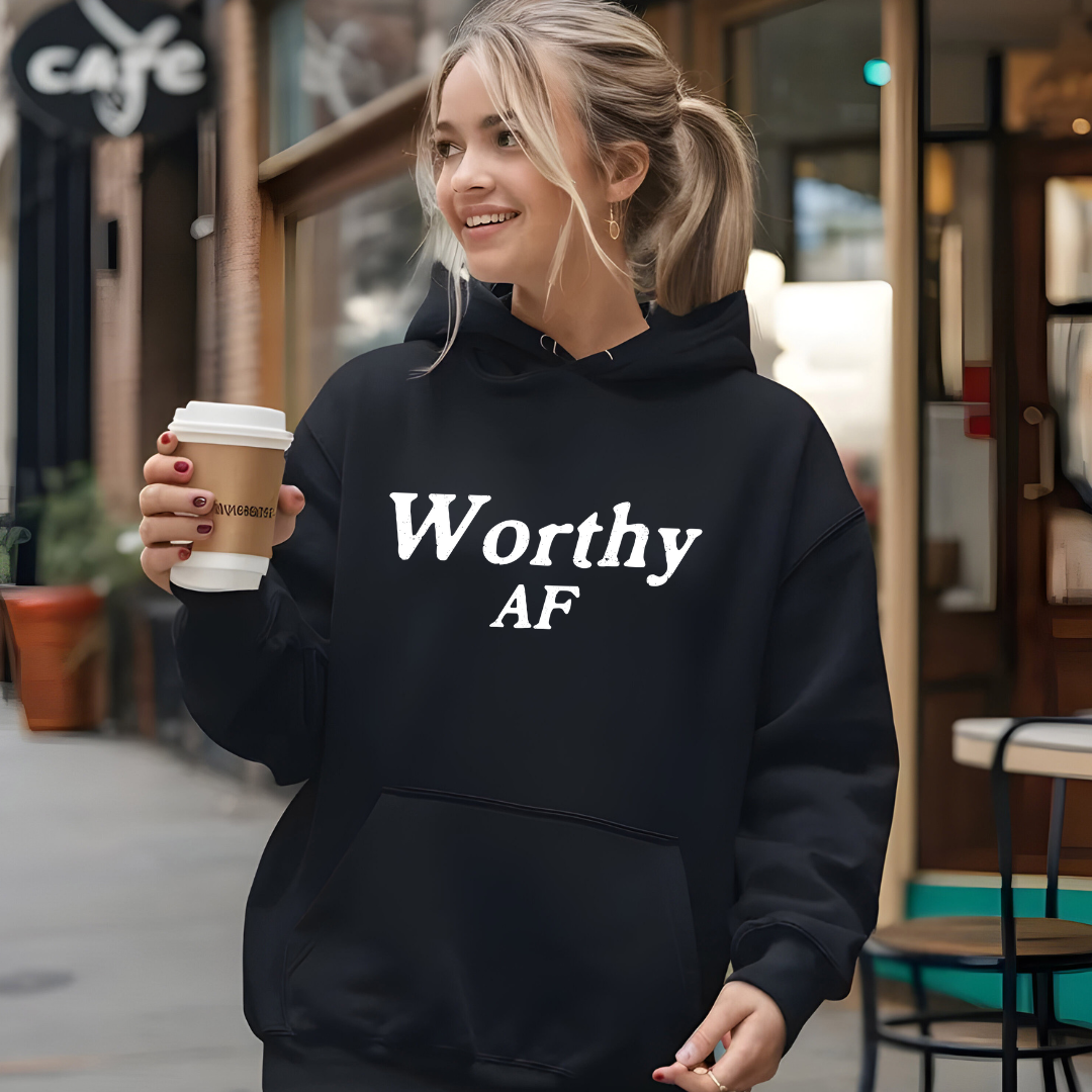Model wearing a hoodie with Worthy AF printed in block letters and centered on the chest.
Wear it, own it, live it.